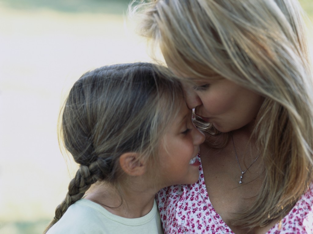 Mother Kissing Daughter