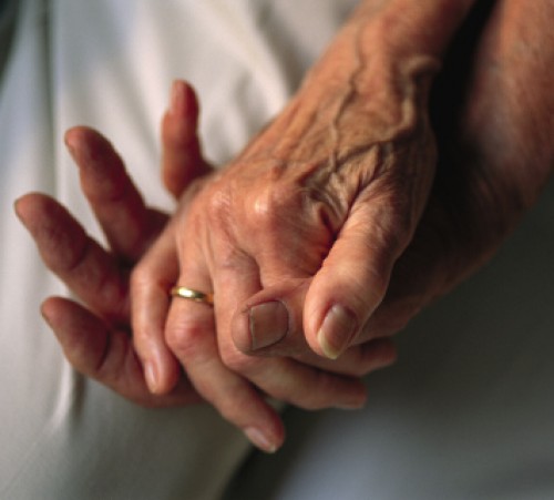 Lincoln, Nebraska. An elderly couple's entwined hands.