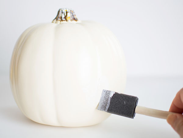 Applying-Mod-Podge-to-pumpkin