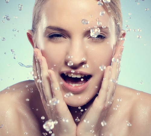 Young-and-beautiful-woman-washing-her-face