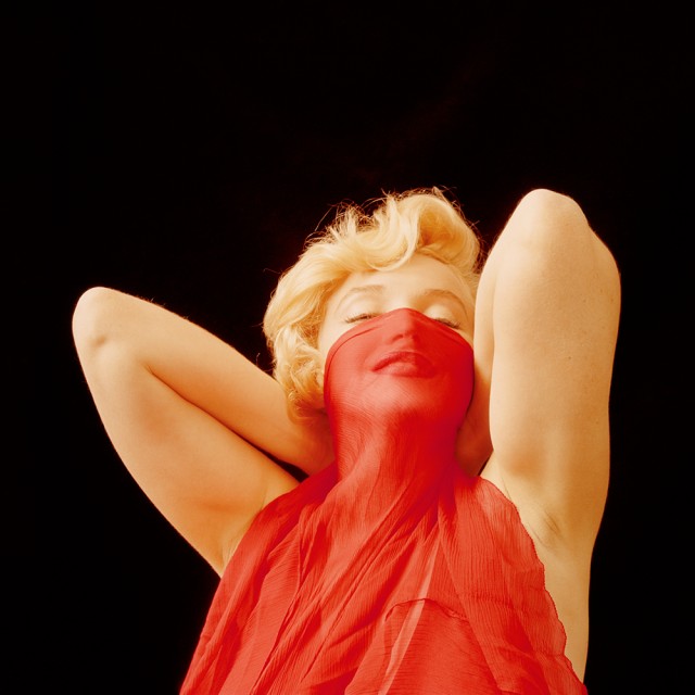 1453489792-1453414254-hbz-marilyn-playing-with-a-red-veil-ny-1957-milton-h-greene-archive-images