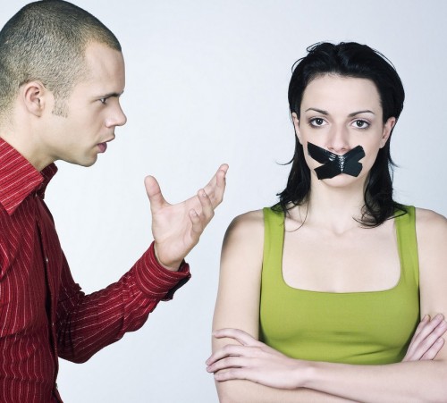 young couple conflict on isolated background