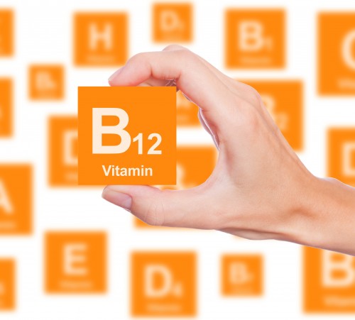 Hand holds a box of vitamin B12